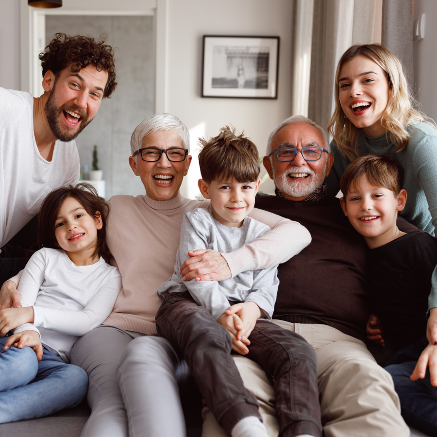 Multigenerational family happy and sitting together.