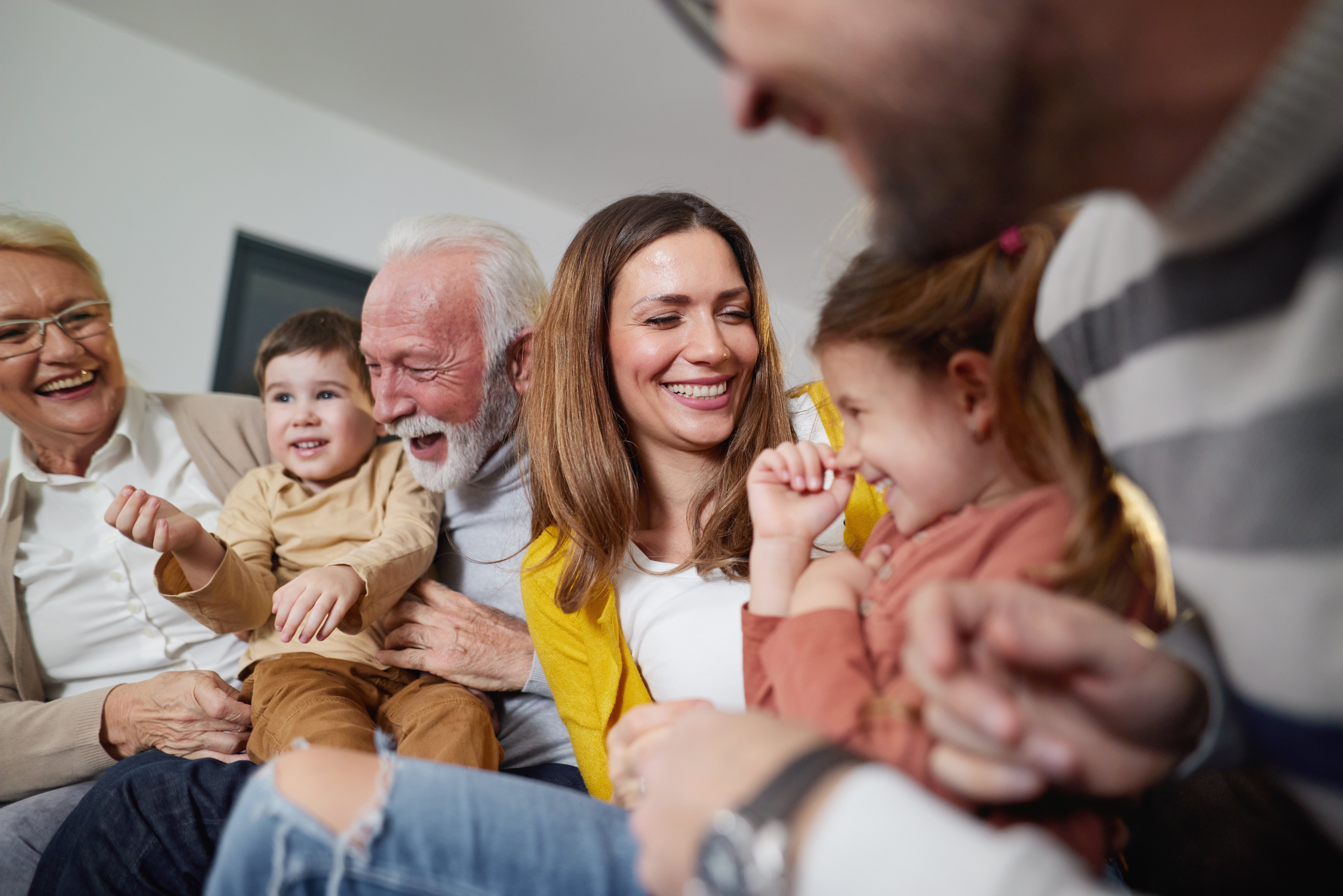 Multigenerational Family Laughing Together at Home