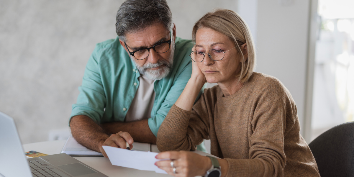 Married husband and wife reviewing retirement plans.