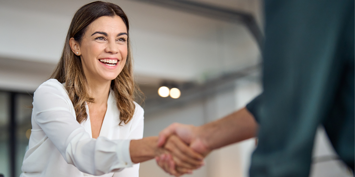 Woman receiving a promotion at her work.